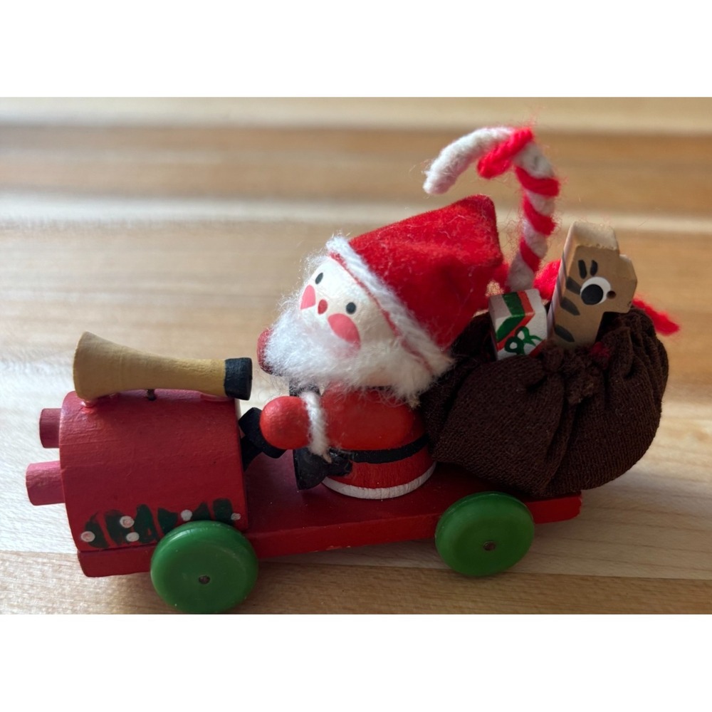 Vintage wooden christmas ornament santa riding a red train with toys